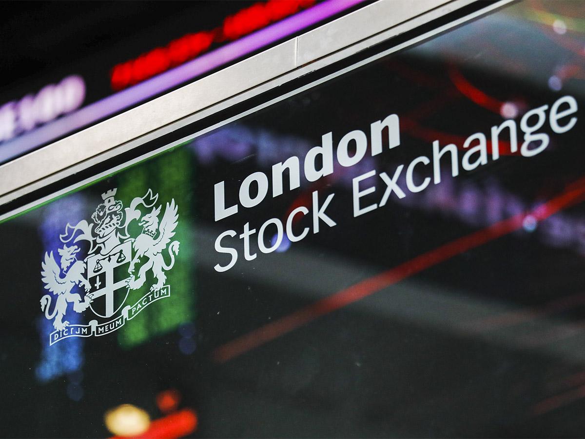 The London Stock Exchange sign on a glass window