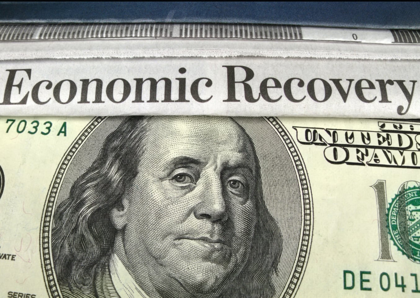 US dollar note with the words economic recovery on it