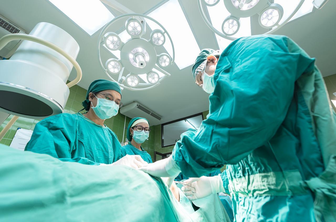 doctors and nurses in operating theatre