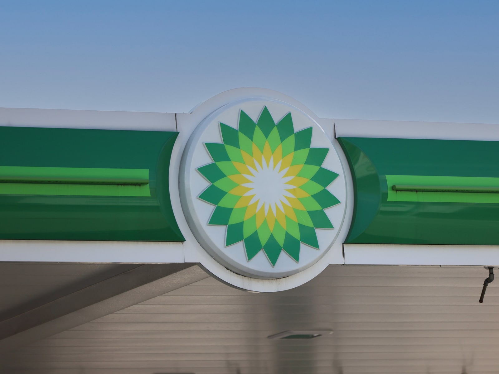 The BP logo appears above a petrol station forecourt.