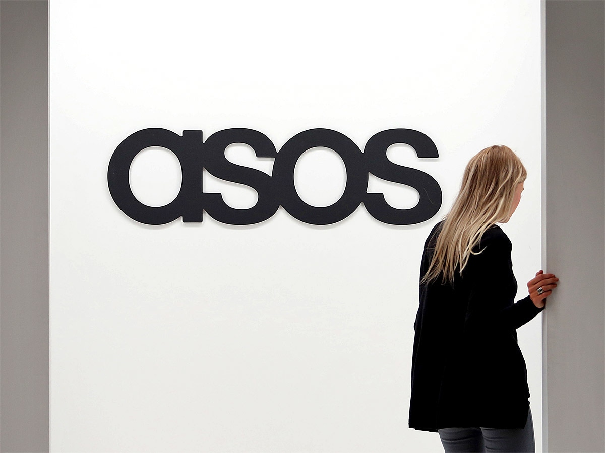 ASOS share price: an ASOS employee enters an office