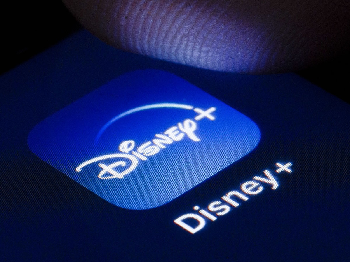 Disney share price: A device shows the Disney+ app logo.