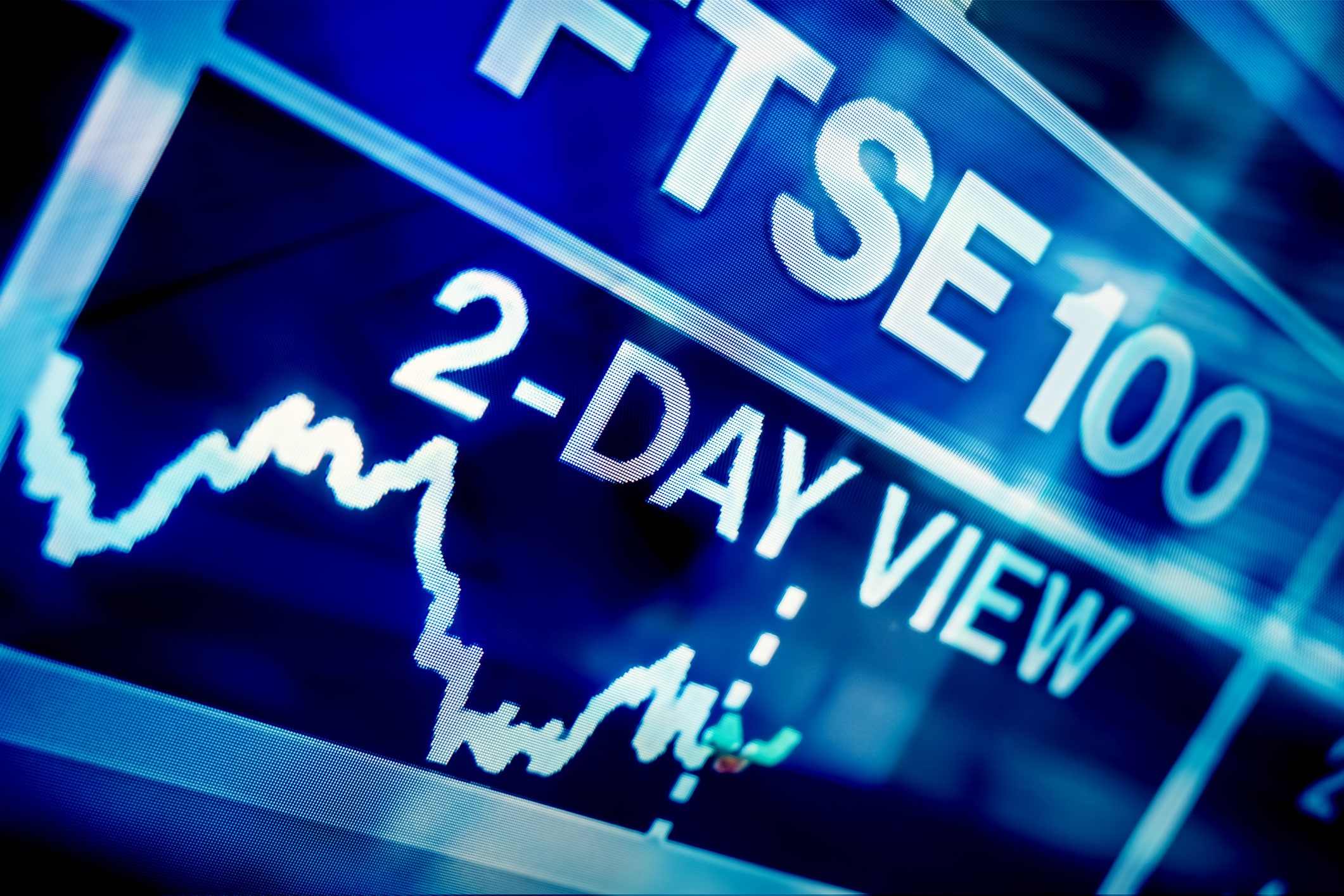 A blue screen showing a close-up of a FTSE 100 chart