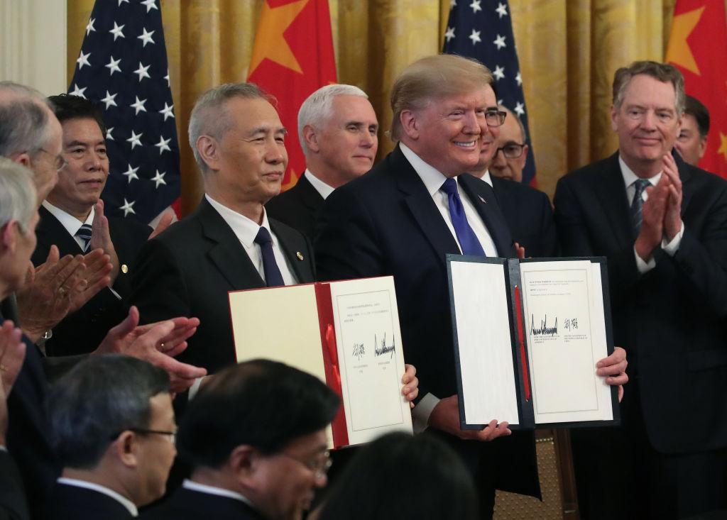 Caution prevails as US and China seal the deal