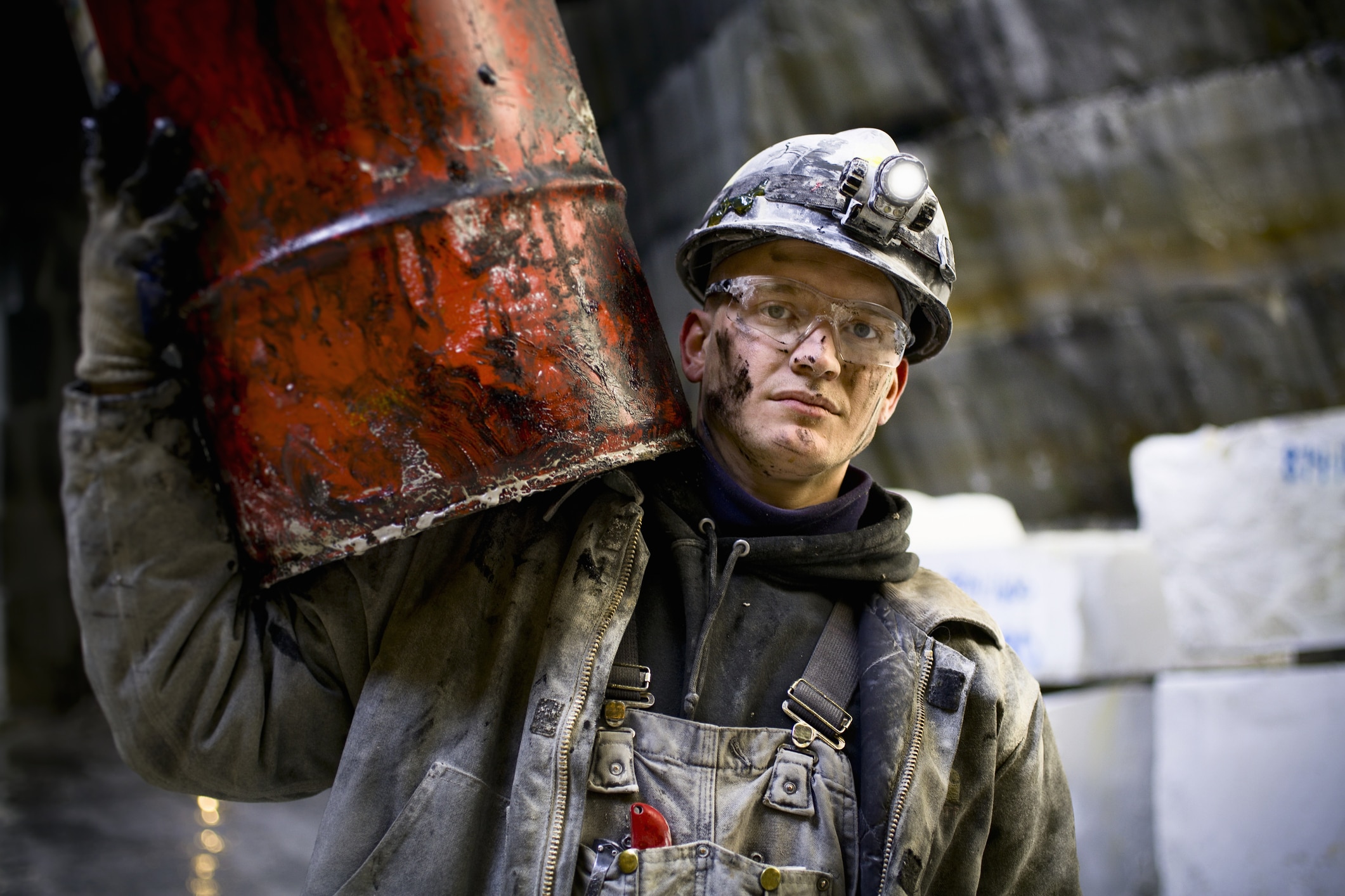 oil worker holding an oil barrel