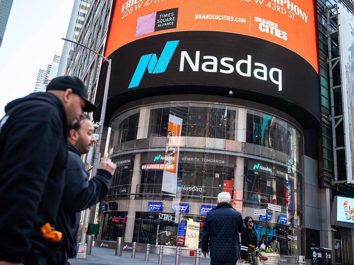 The Nasdaq logo is displayed on the outside of a building in New York.