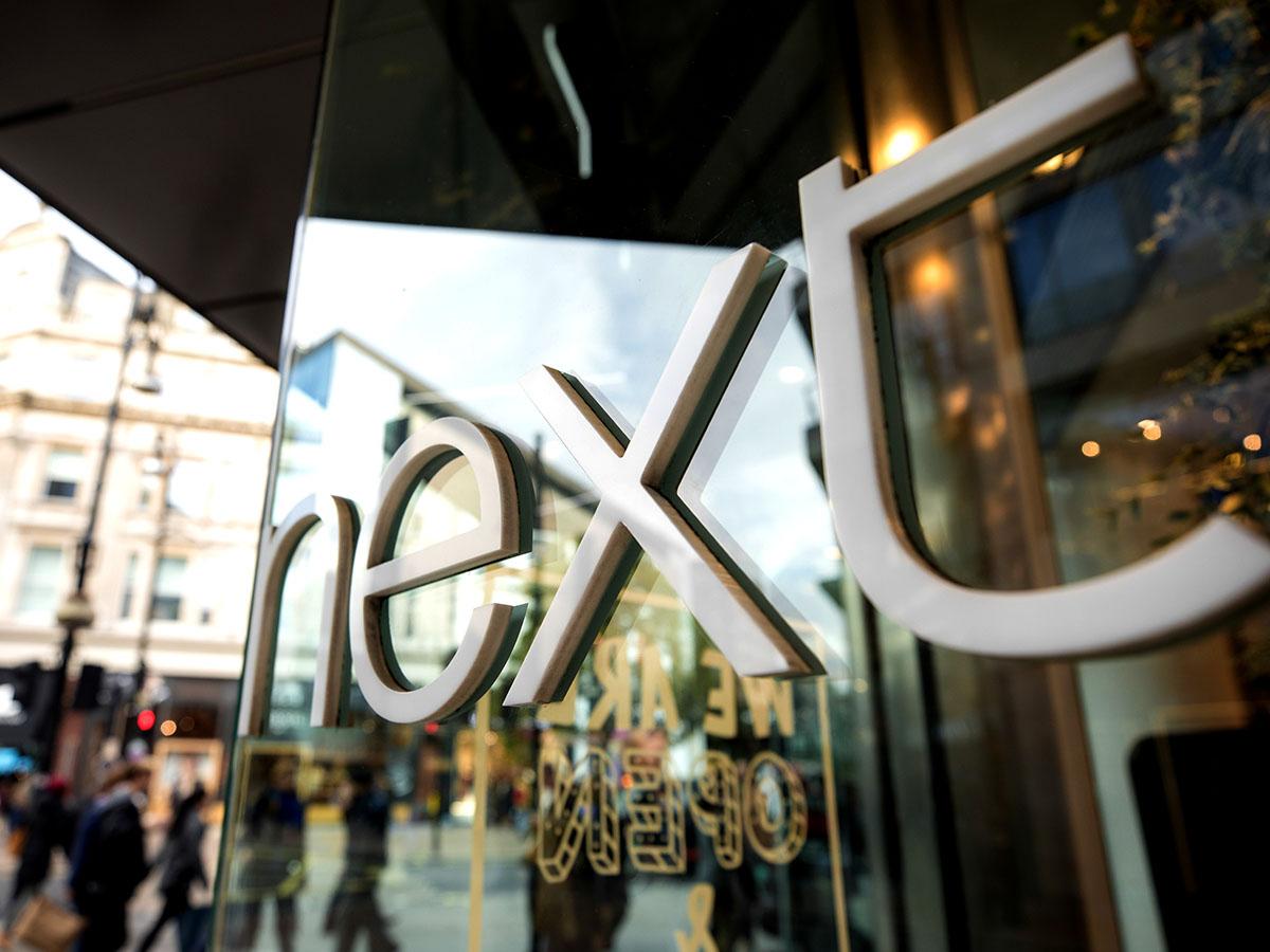 A Next glass shop front: Next helps pull the FTSE 100 around