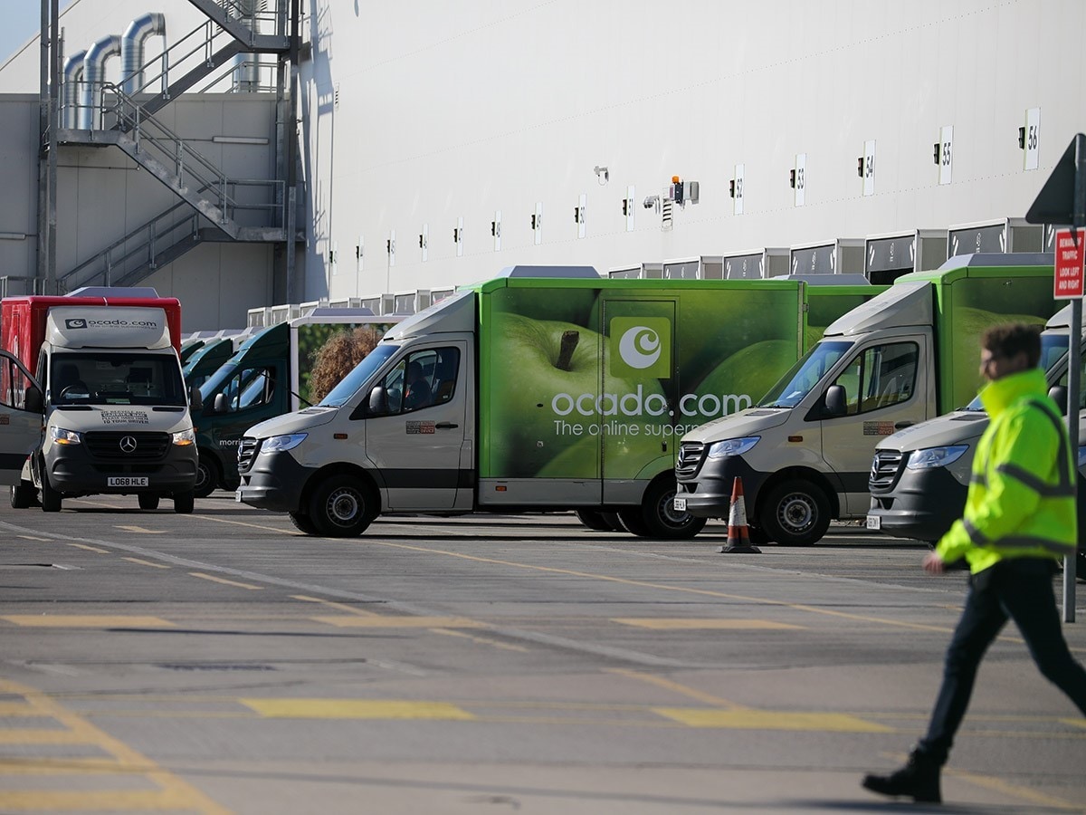 Ocado share price: Ocado delivery vans in a parking lot