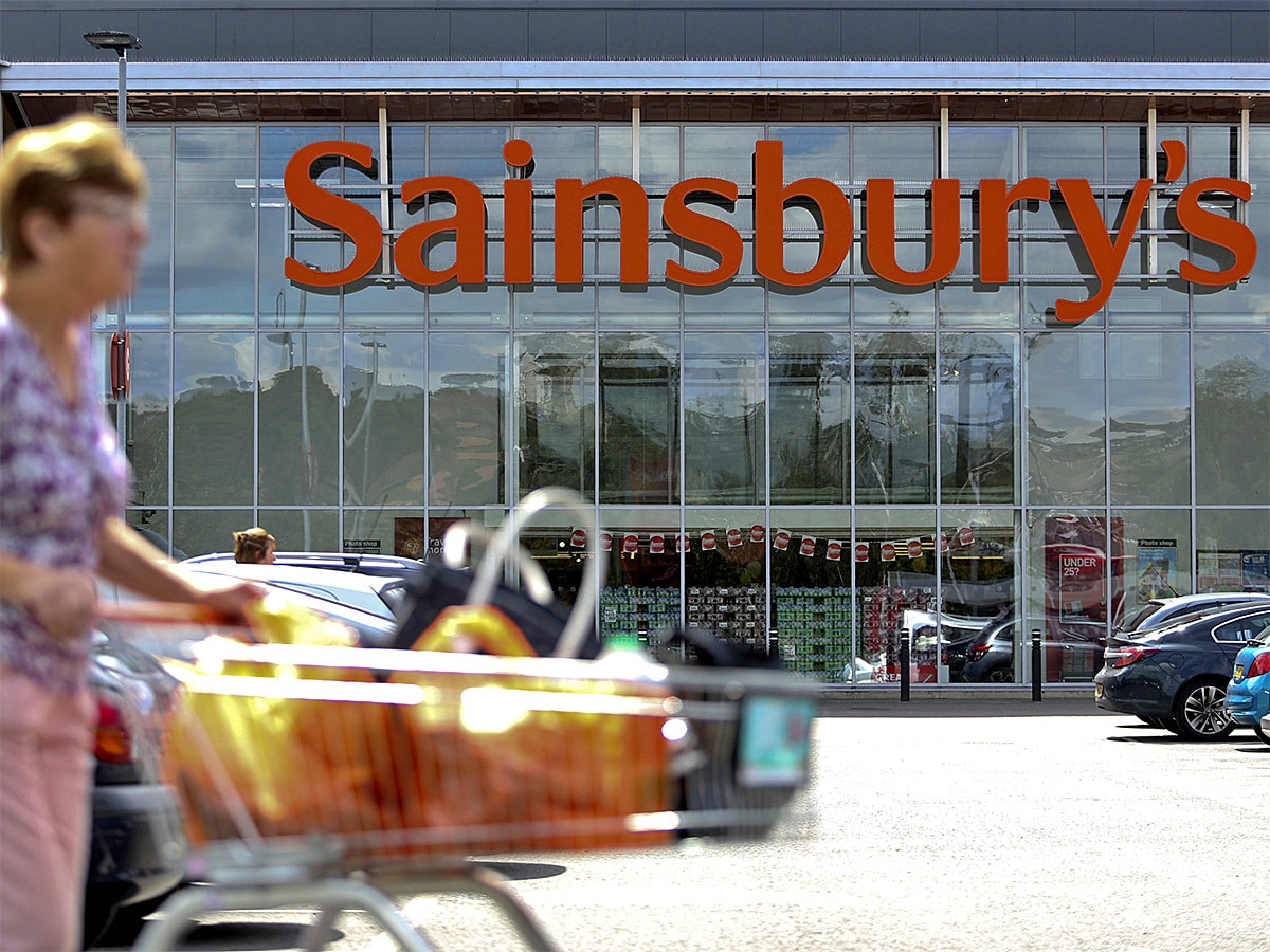 Sainsbury's share price: A Sainsbury's shopper pushes a trolley