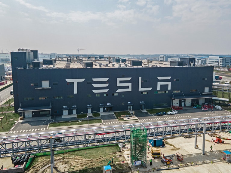 Tesla shares dip after cutting Shanghai plant production target