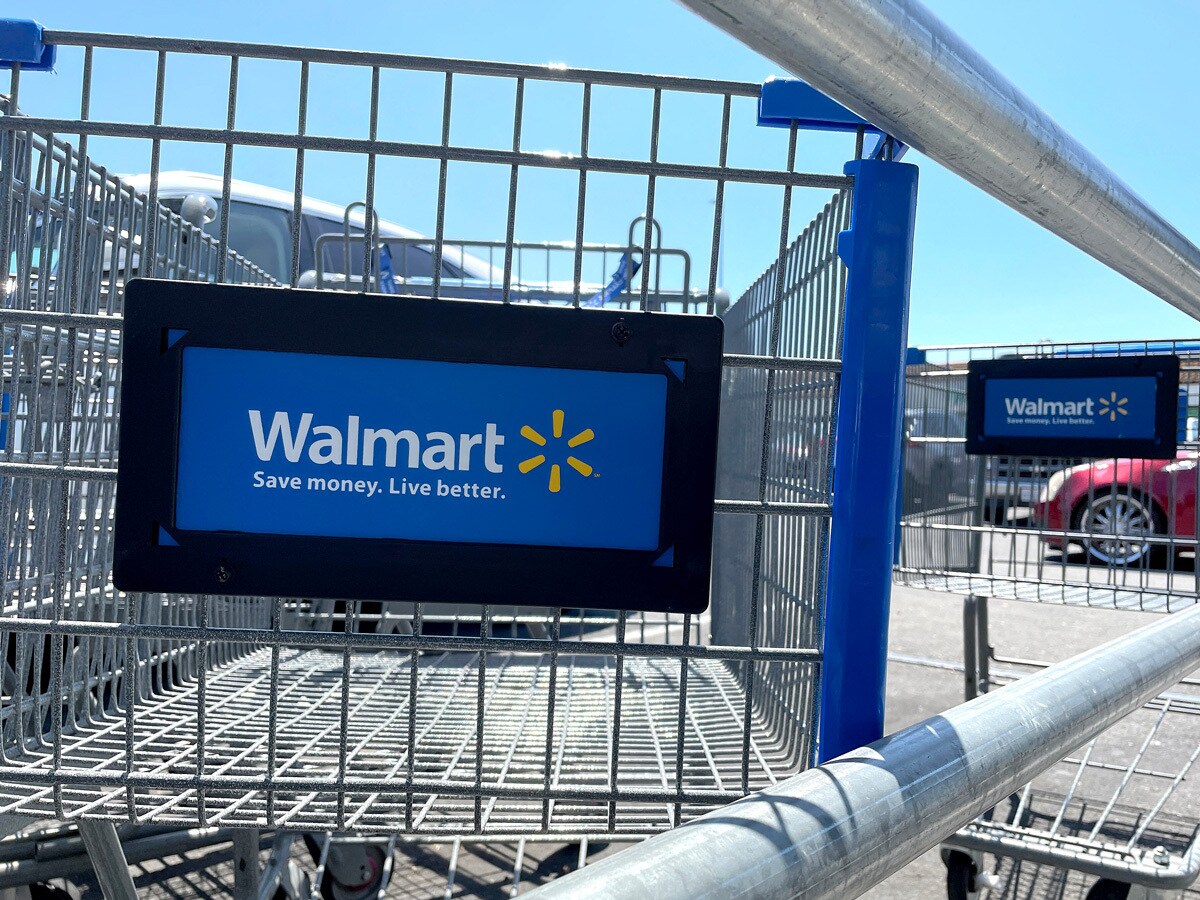 Walmart logo on a trolley outside a supermarket