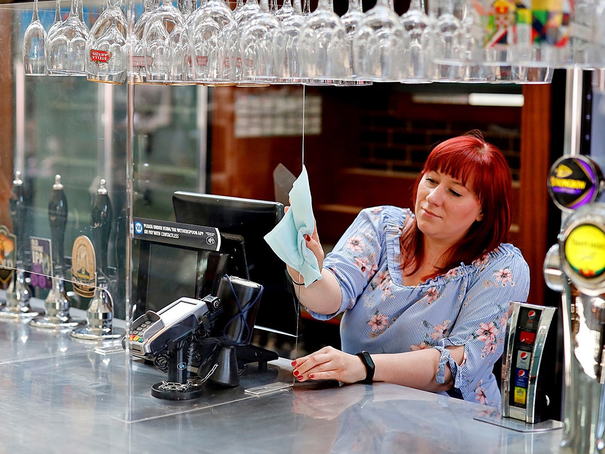 Bartender working in a Wetherspoons pub