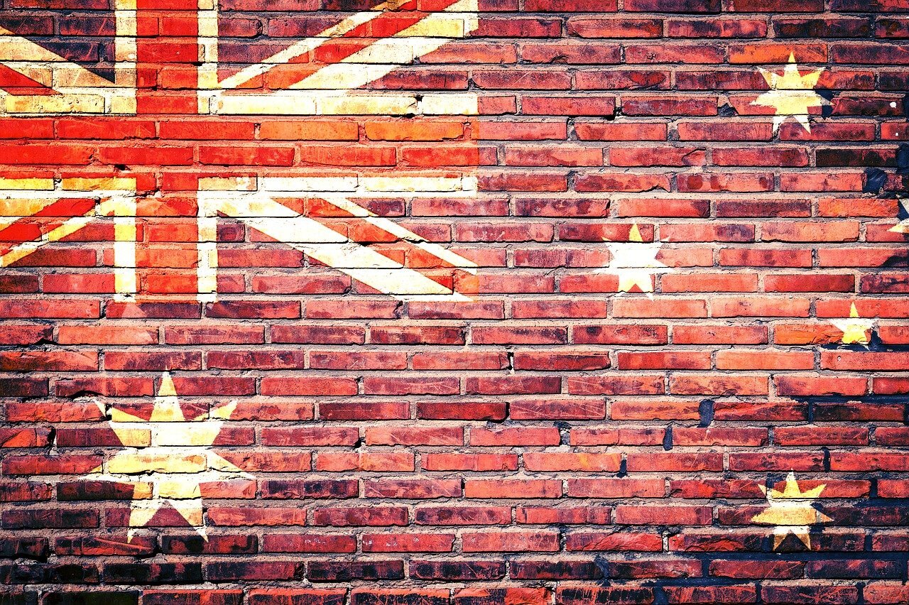australian flag painted on a red brick wall