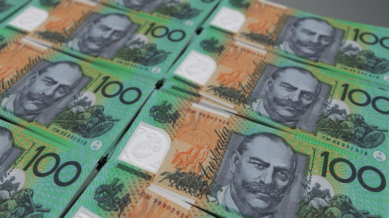 piles of Australian 100 dollar notes