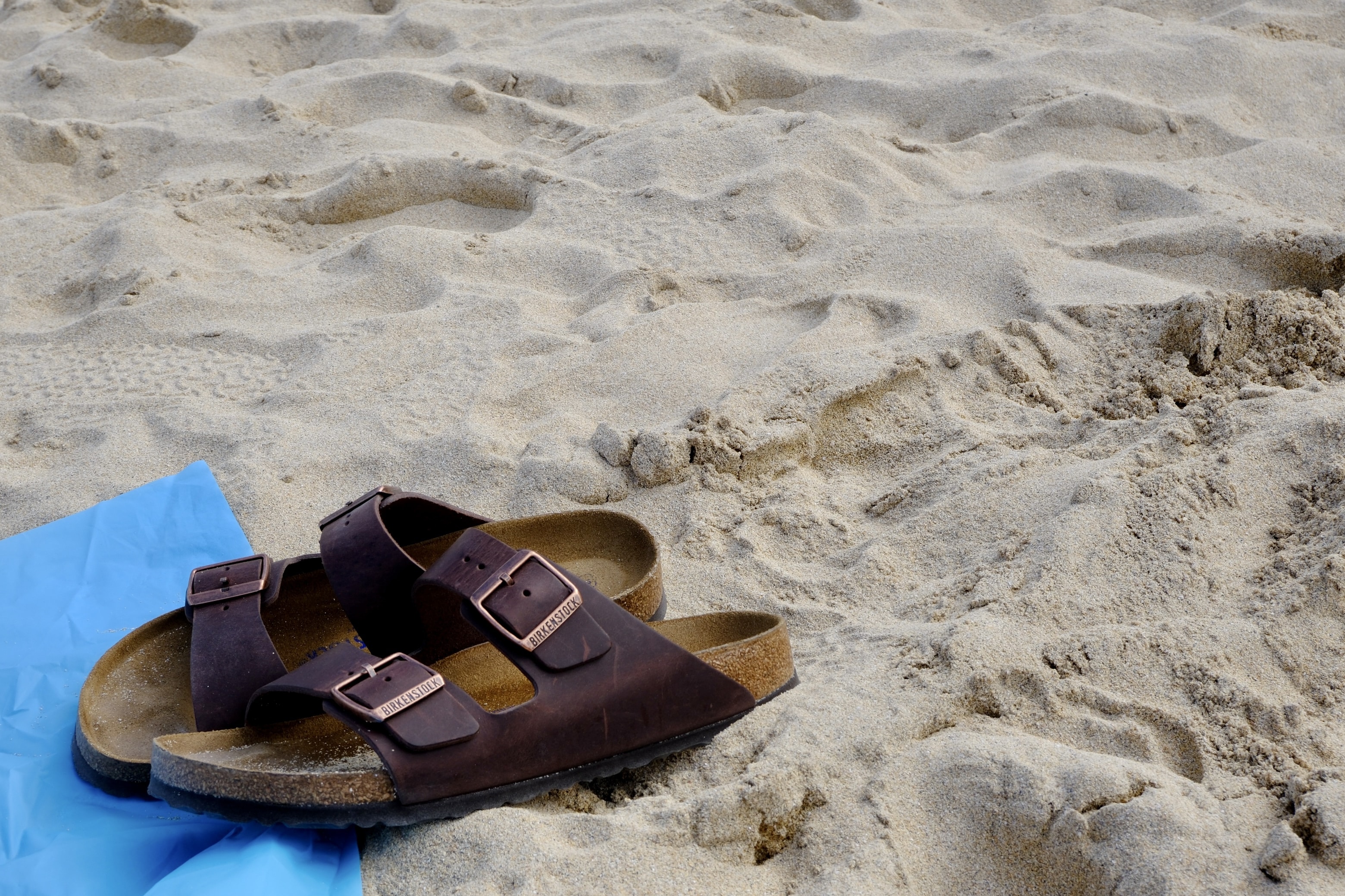 Birkenstock sandals on a beach