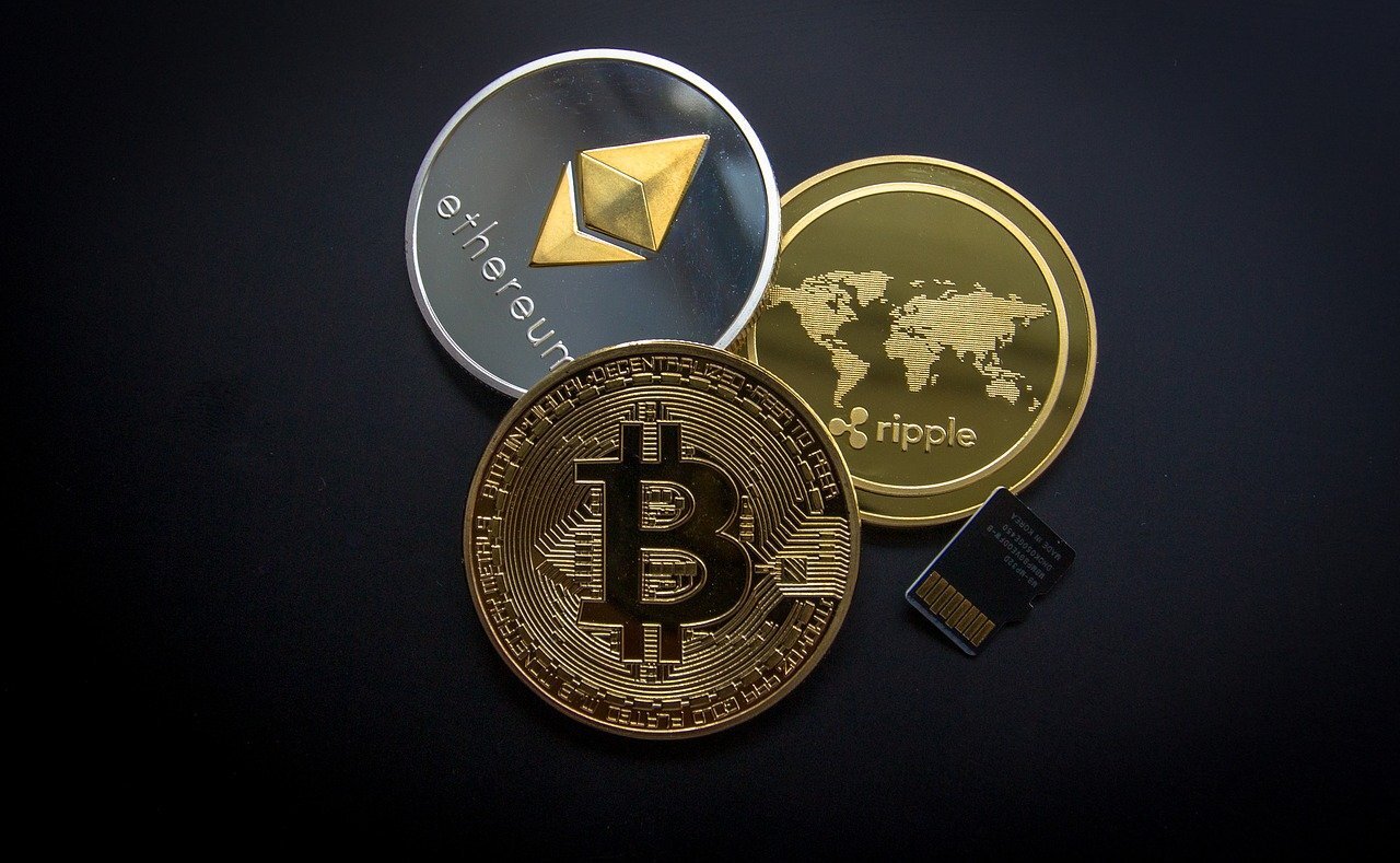 cryptocurrencies bitcoin ripple ethereum on a black background