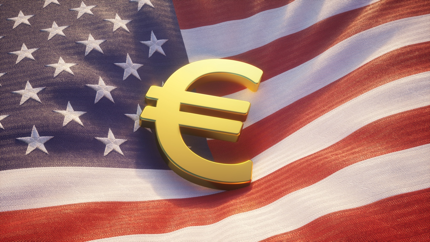Euro symbol laying on a US flag
