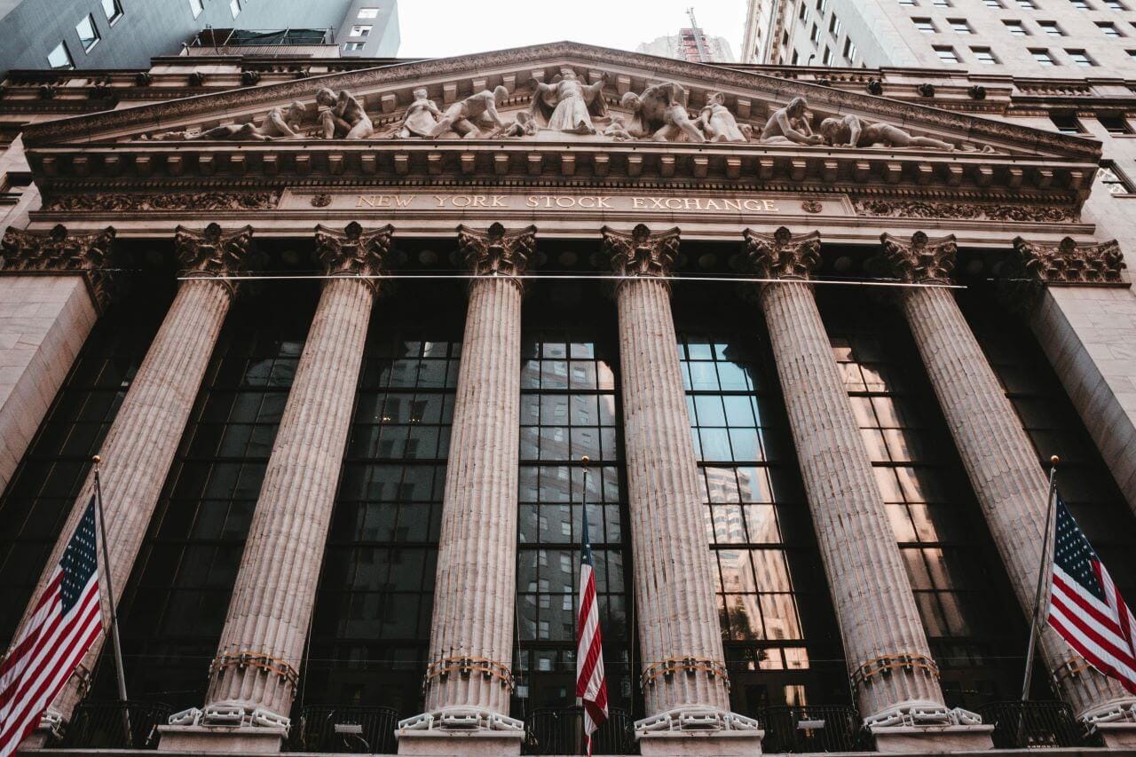 New York stock exchange building with columns and a flag