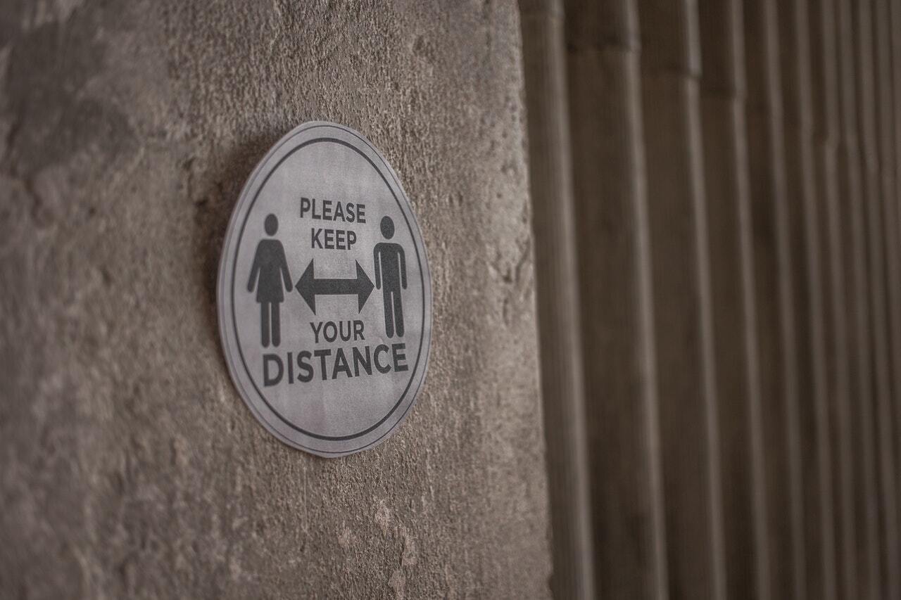 sign asking people to keep social distance