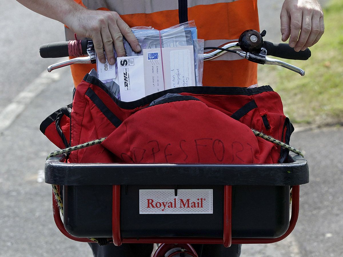 Royal Mail share price: a person delivers post
