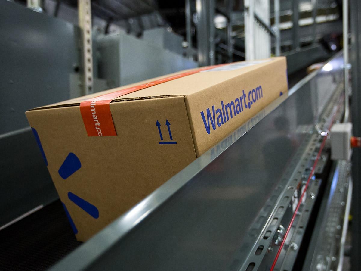 How did Walmart's share price outperform Amazon?